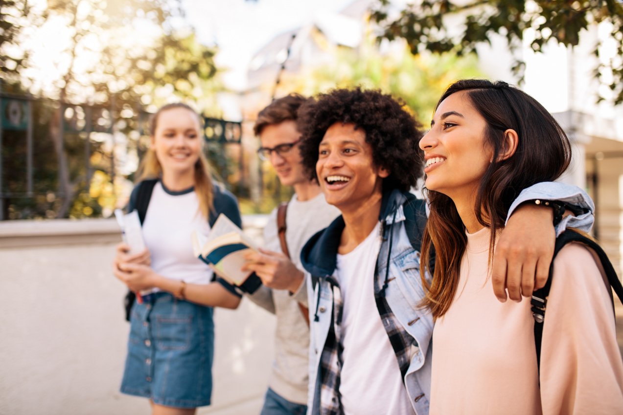 College Students Walking Together Outdoors